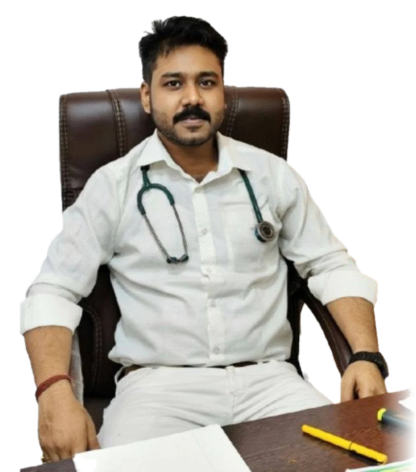 Dr. Manash Mandal, Ayurvedic doctor, seated at his desk with a stethoscope